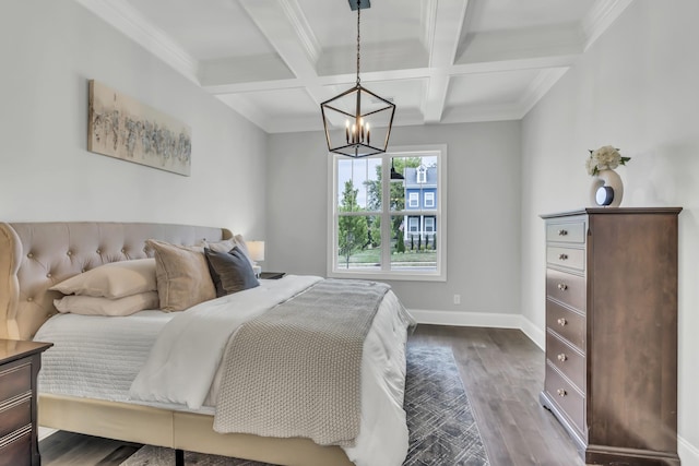 bedroom with hardwood / wood-style floors, an inviting chandelier, coffered ceiling, ornamental molding, and beam ceiling