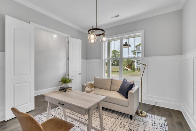 living room with crown molding and hardwood / wood-style flooring