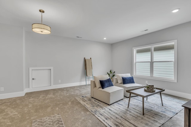 living area featuring light colored carpet