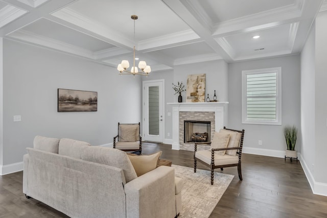 living room with coffered ceiling, dark wood-type flooring, crown molding, a notable chandelier, and beamed ceiling