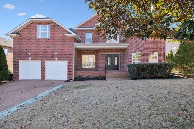 view of property featuring a garage and french doors