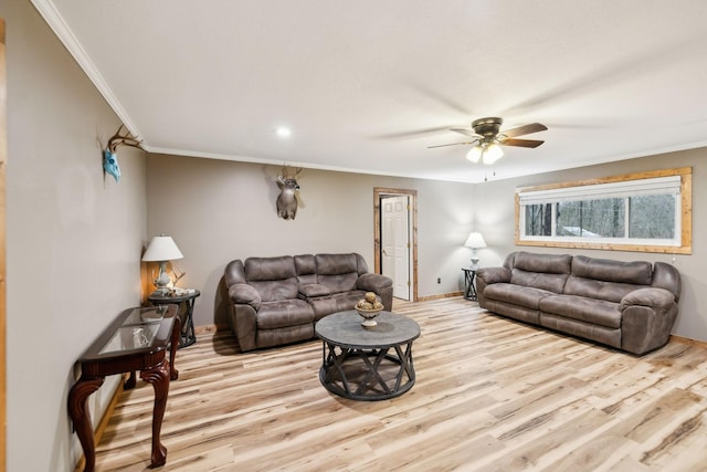 living room with ceiling fan, light hardwood / wood-style flooring, and crown molding