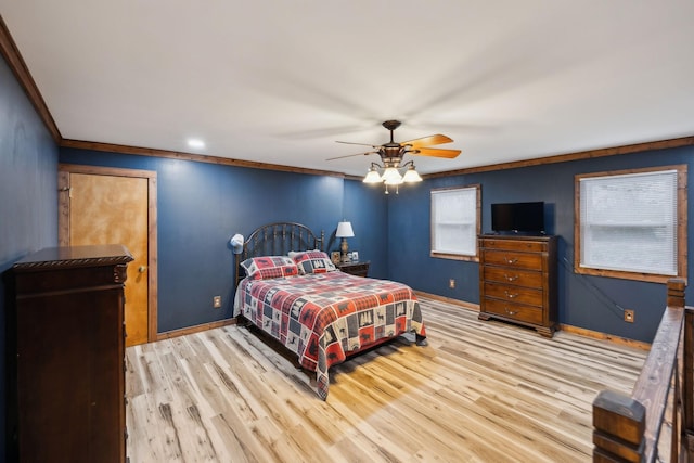 bedroom featuring ceiling fan, ornamental molding, and light hardwood / wood-style flooring