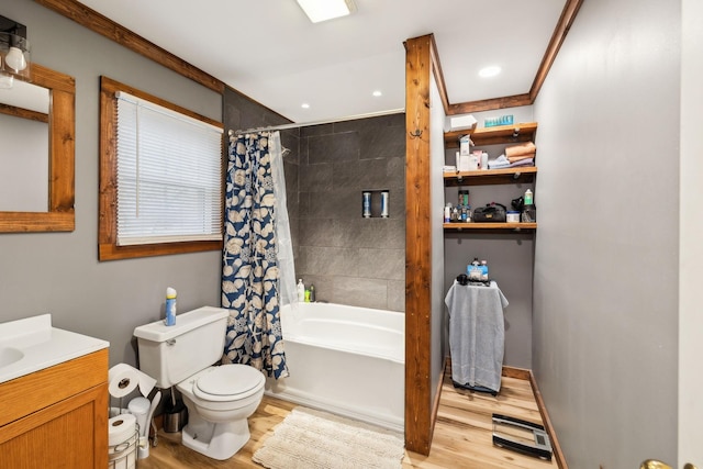 full bathroom featuring vanity, hardwood / wood-style floors, shower / bathtub combination with curtain, and toilet