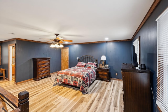 bedroom with light wood-type flooring, ceiling fan, ornamental molding, and connected bathroom