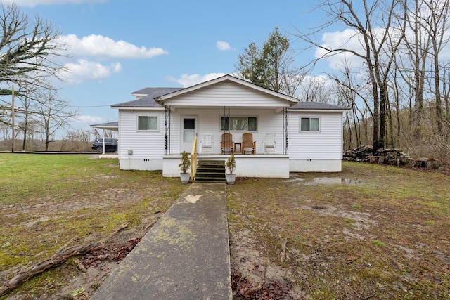 view of front of house with covered porch and a front yard