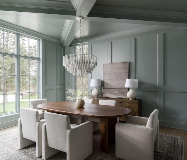 dining area with a notable chandelier, beam ceiling, crown molding, and coffered ceiling