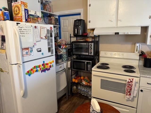 kitchen with dark hardwood / wood-style flooring, white cabinets, and white appliances