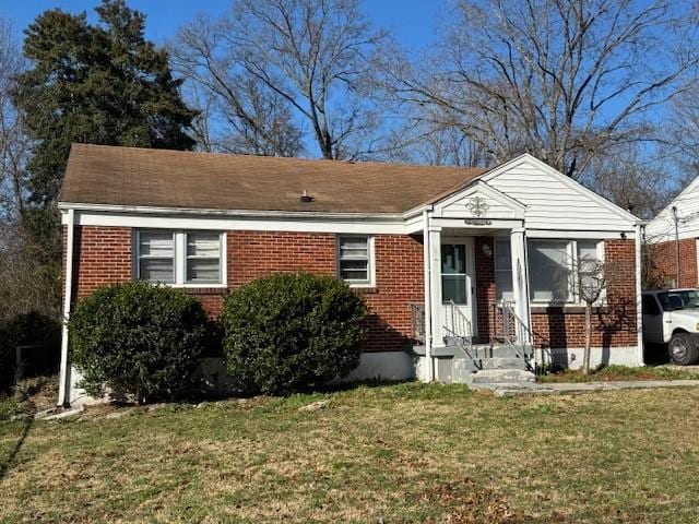 view of front of home with a front yard