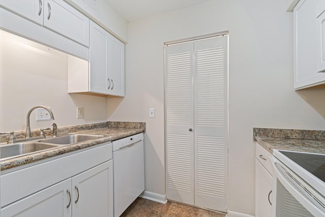 kitchen with a sink, baseboards, white appliances, and white cabinets