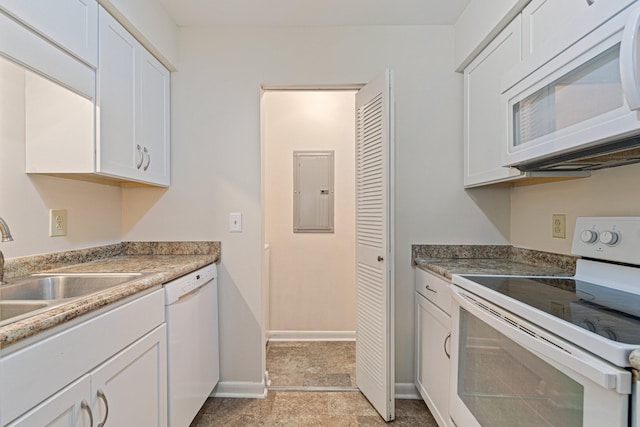 kitchen with white appliances, baseboards, electric panel, a sink, and white cabinetry