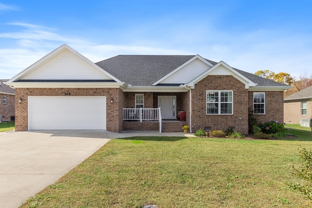 view of front facade with a porch, a garage, and a front lawn