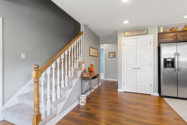 interior space with hardwood / wood-style floors and a textured ceiling