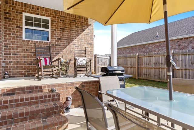 view of patio featuring a grill