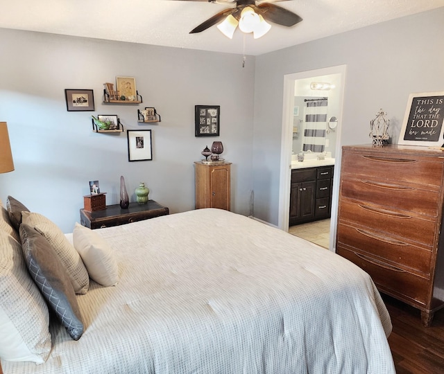 bedroom with light wood-type flooring, ensuite bath, and ceiling fan