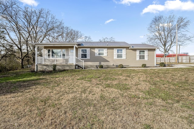 single story home featuring covered porch and a front yard