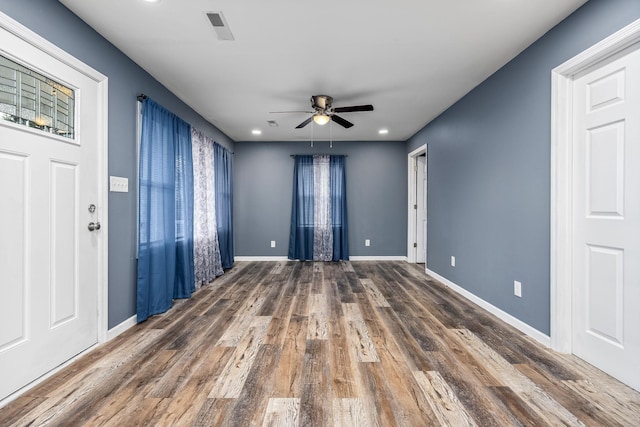 foyer featuring ceiling fan and dark hardwood / wood-style flooring