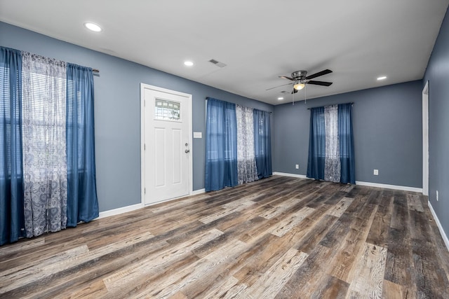 interior space with ceiling fan and wood-type flooring