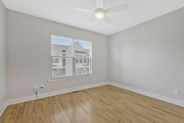 unfurnished room featuring ceiling fan and light wood-type flooring