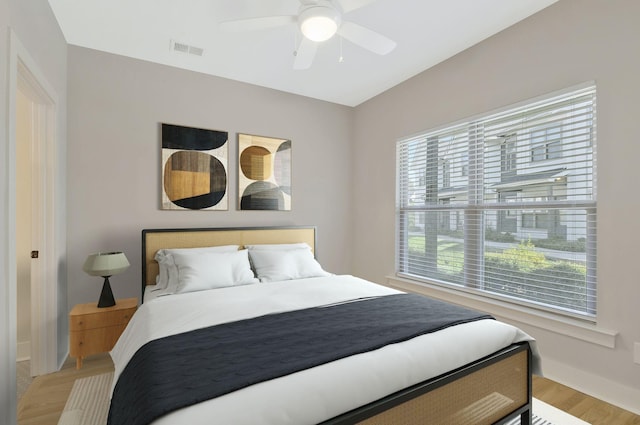 bedroom featuring light wood-type flooring and ceiling fan