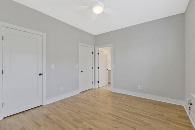 unfurnished bedroom featuring ceiling fan and light wood-type flooring