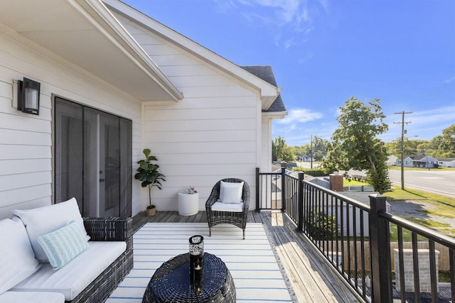 wooden deck featuring an outdoor living space