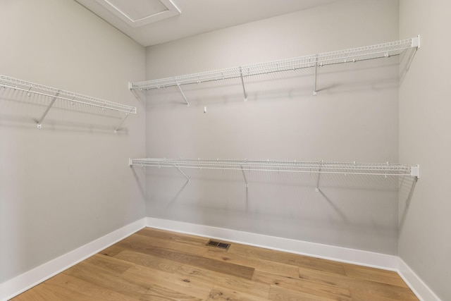 walk in closet featuring wood-type flooring