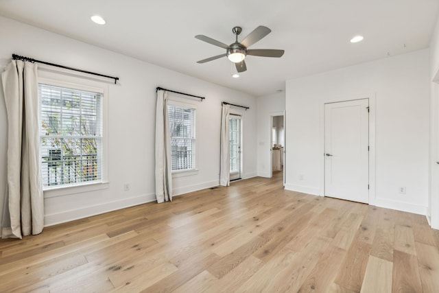 unfurnished bedroom with ceiling fan and light hardwood / wood-style floors