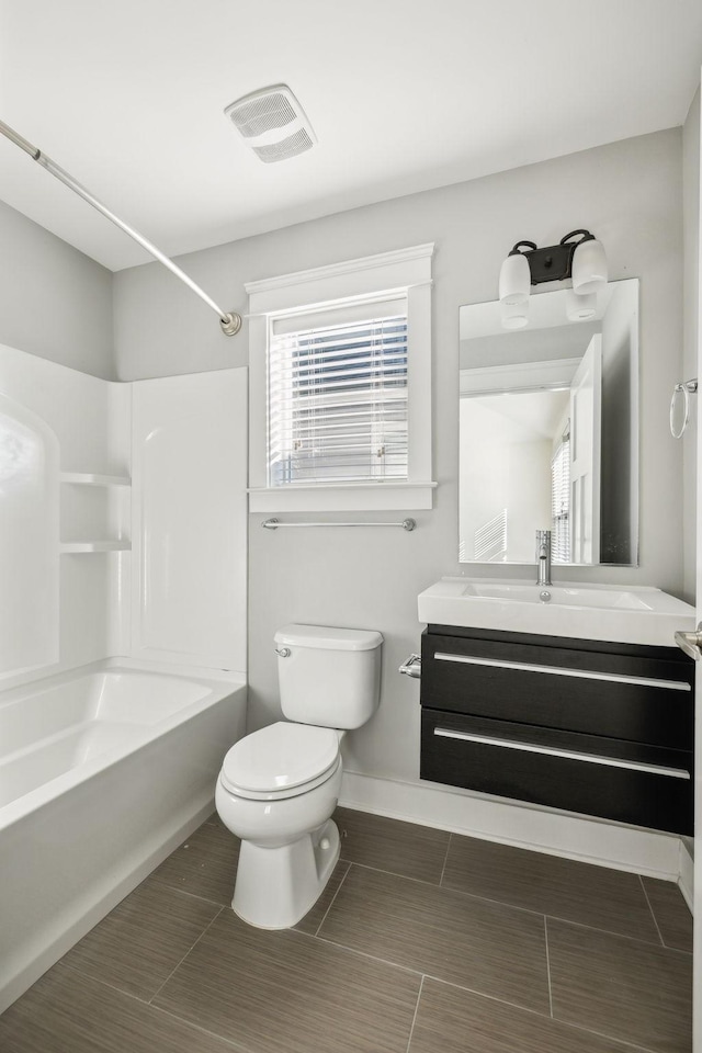 full bathroom featuring vanity, shower / bathing tub combination, and toilet