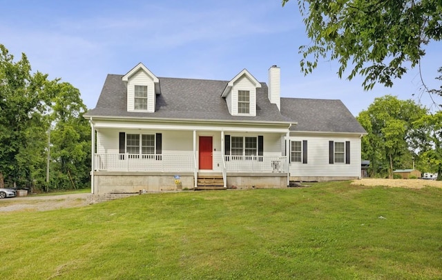 new england style home featuring a front lawn and a porch