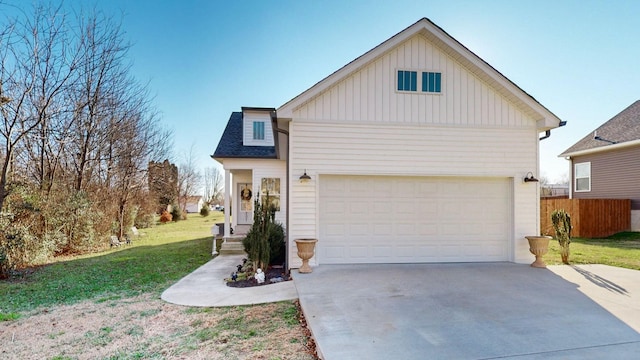 view of front of house with a garage and a front lawn