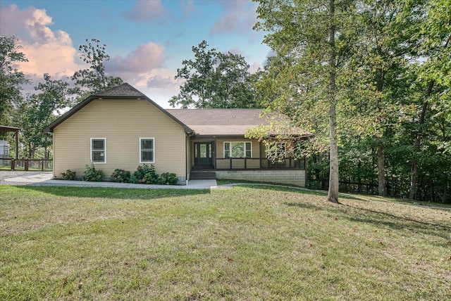 view of front of home with a lawn