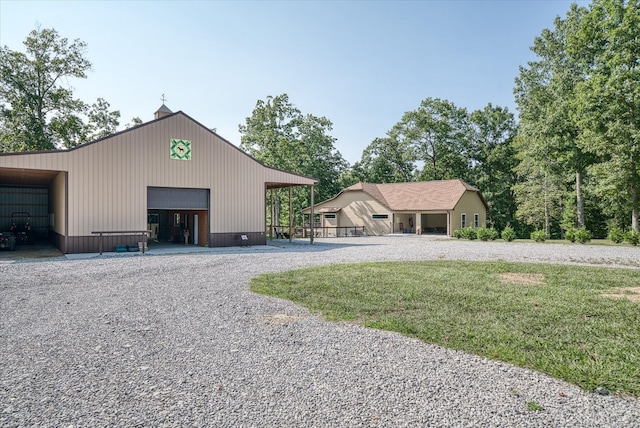 view of front of house featuring an outbuilding and a garage