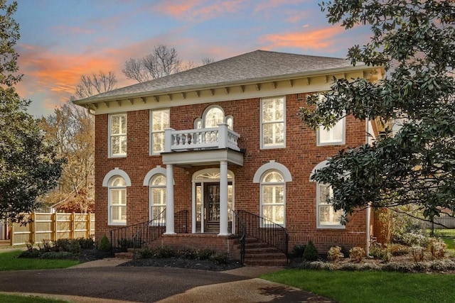 view of front of property with a balcony