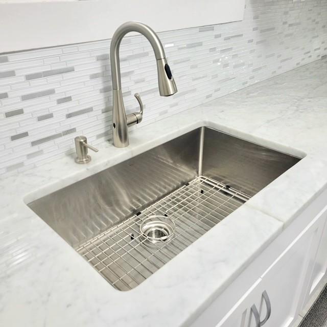 details featuring sink and backsplash