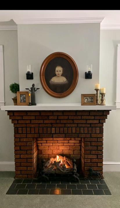 room details featuring crown molding and a fireplace