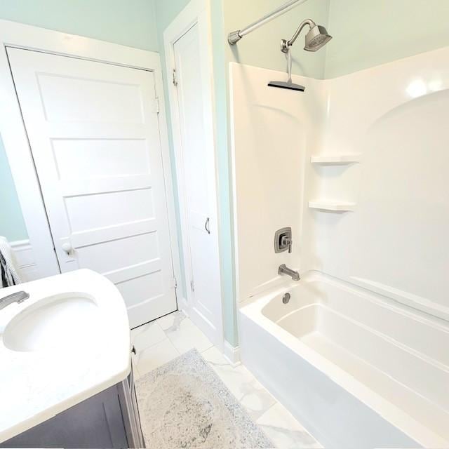 bathroom featuring  shower combination and sink