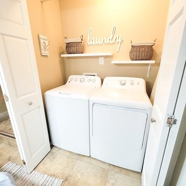 laundry area with separate washer and dryer