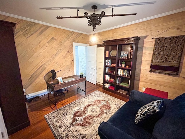 office featuring wood walls, hardwood / wood-style flooring, and ornamental molding