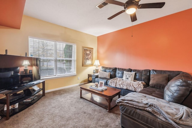 carpeted living room with ceiling fan