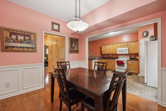 dining room featuring light hardwood / wood-style floors