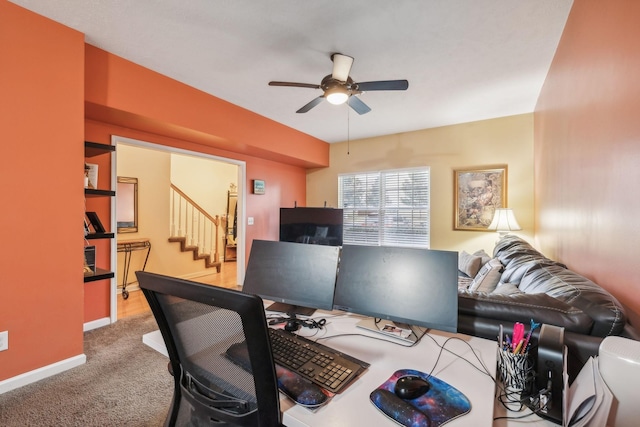 carpeted home office with ceiling fan