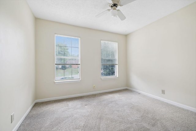 unfurnished room with carpet and ceiling fan