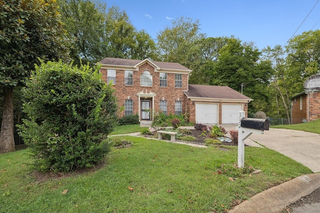 colonial house featuring a front yard and a garage