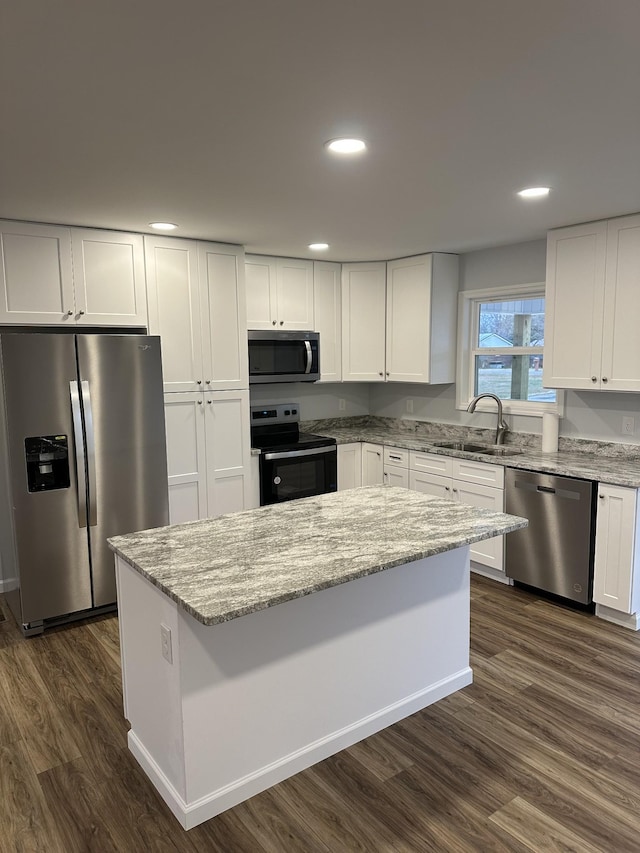 kitchen featuring sink, white cabinets, and appliances with stainless steel finishes