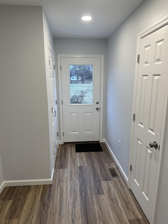 doorway to outside with dark hardwood / wood-style flooring