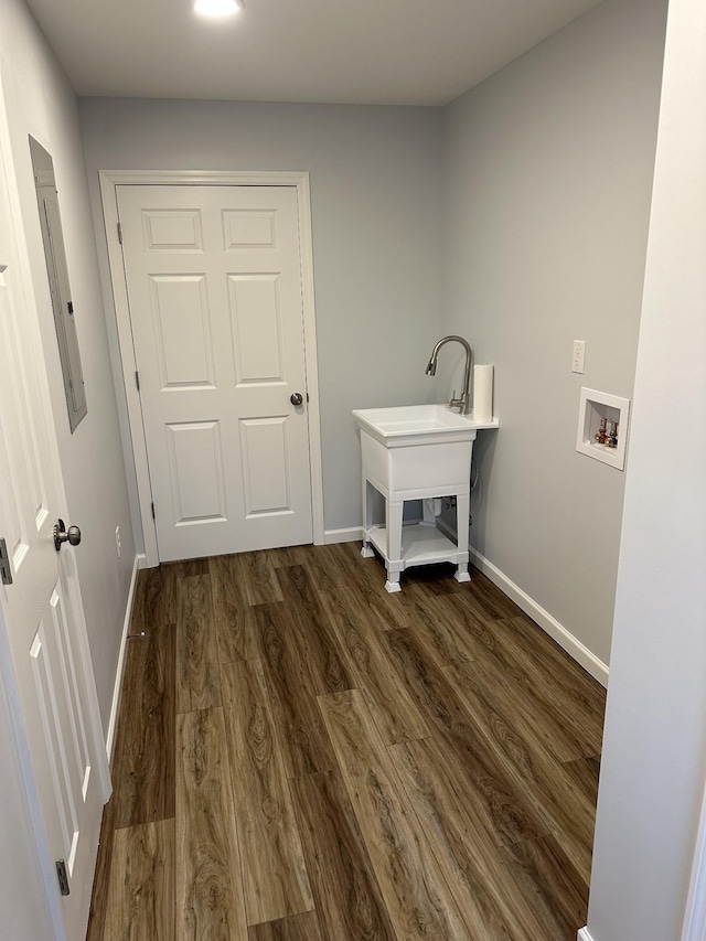 laundry area with washer hookup, dark hardwood / wood-style flooring, and electric panel