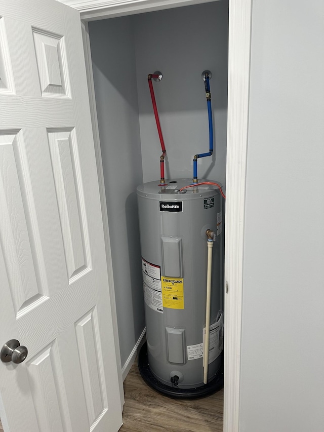 utility room featuring electric water heater