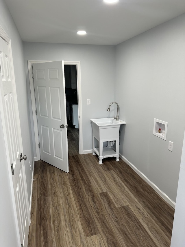 laundry room with laundry area, dark wood-type flooring, hookup for a washing machine, and baseboards