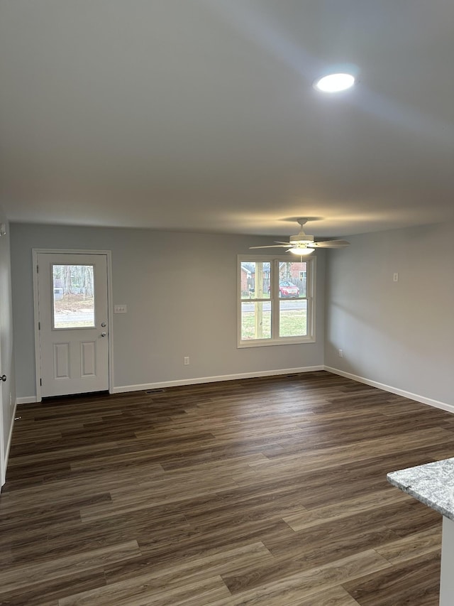 interior space with dark wood-style floors, ceiling fan, recessed lighting, and baseboards